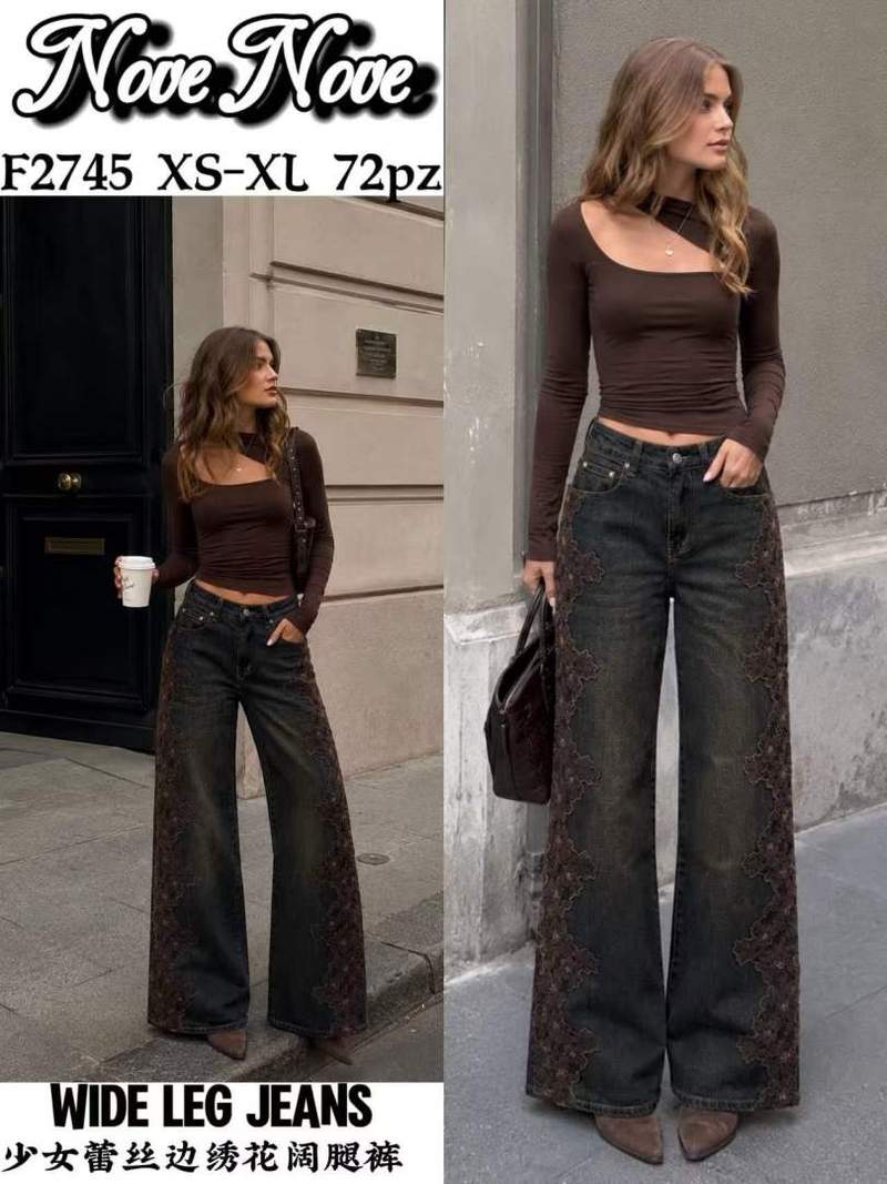 Jeans a gamba larga con bordo in pizzo e ricami