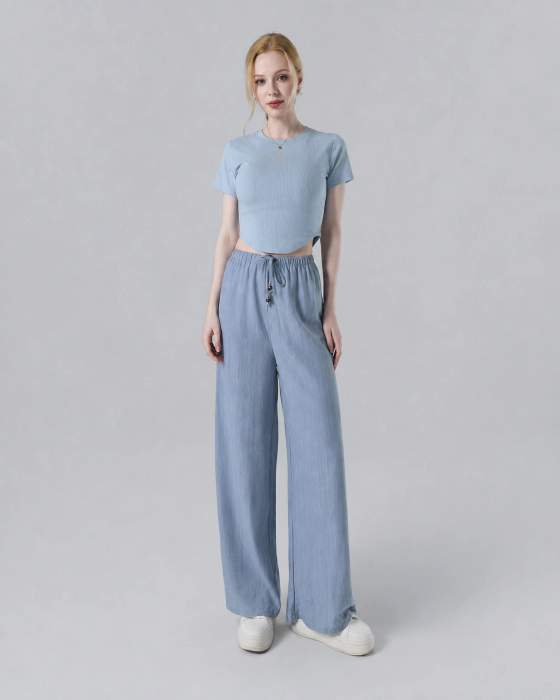 Completo donna con top corto e pantaloni palazzo