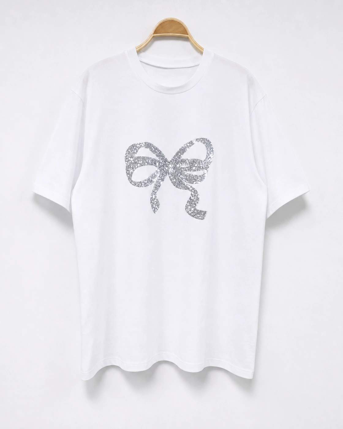 T-shirt con fiocco decorativo
