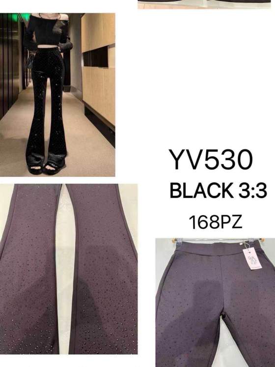Pantaloni a zampa neri con strass