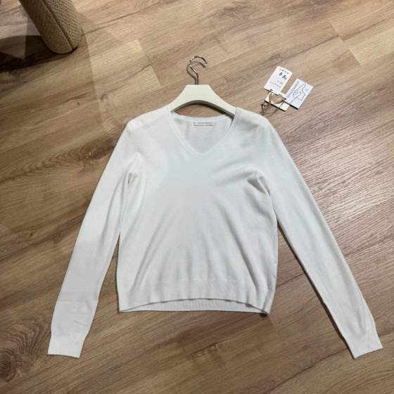 Maglia bianca a maniche lunghe con scollo a V